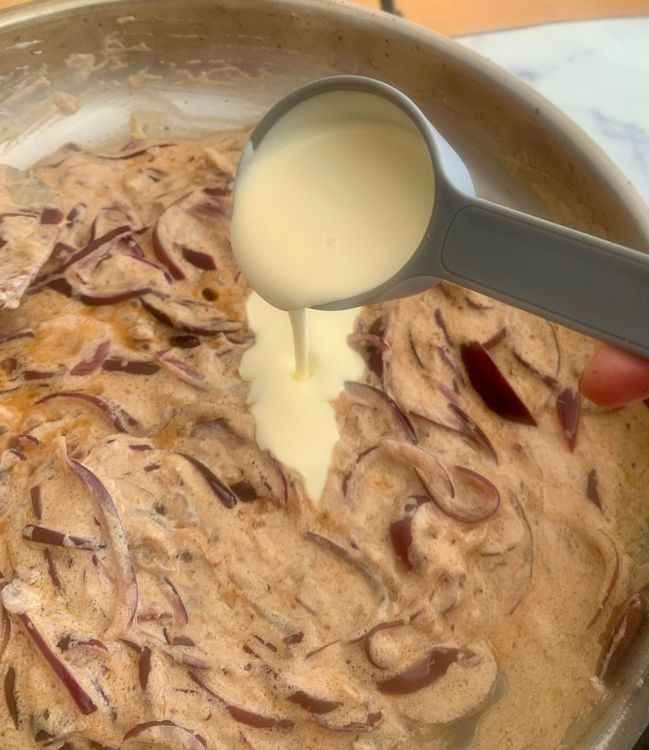 Step 4.1: Add the cream and continue cooking until the oil begins to separate