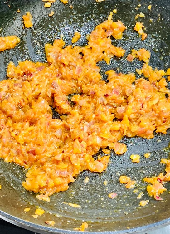 Step 1.2: Add the chopped tomatoes and cook until the tomatoes are soft and oil leaves the sides of the skillet