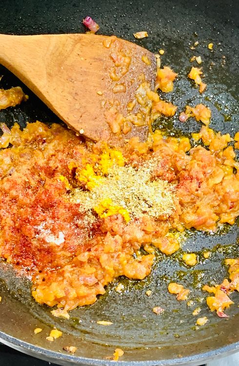 Step 1.1: Mix the red chilli powder, salt, turmeric, and coriander powder
