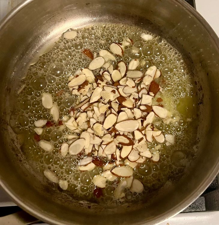 Step 2.1: Add the almond slices and cook until slightly browned, about 2-3 minutes, being careful not to burn them