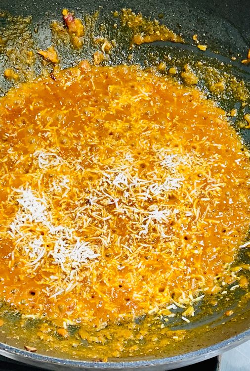 Step 1.1: Mix in the desiccated coconut and cook for another minute
