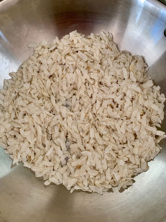Step 2.1: In a dry pan, roast the poha on low-medium heat for 2-3 minutes until it turns crisp