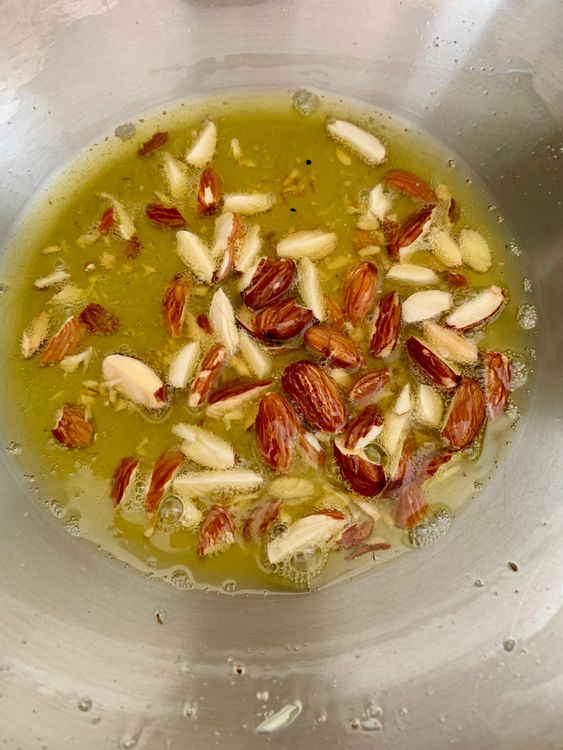 Step 3.1: Add the roughly chopped or diced almonds and fry until lightly golden