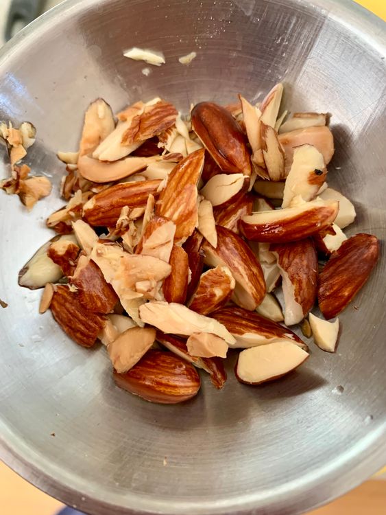 Step 3.2: Add the roughly chopped or diced almonds and fry until lightly golden
