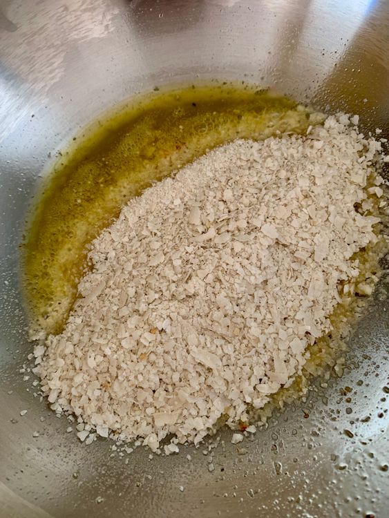 Step 4.1: In the same ghee, add the ground poha and roast for 3-4 minutes until aromatic