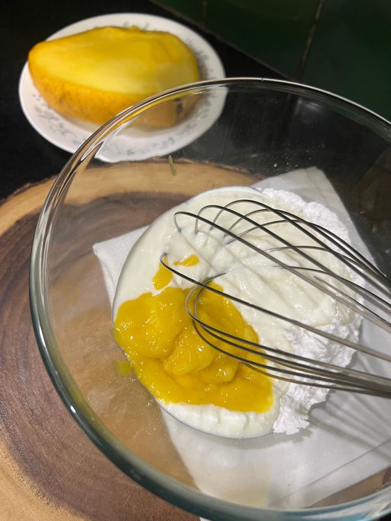 Step 1.2: To this add in the yogurt and mango puree