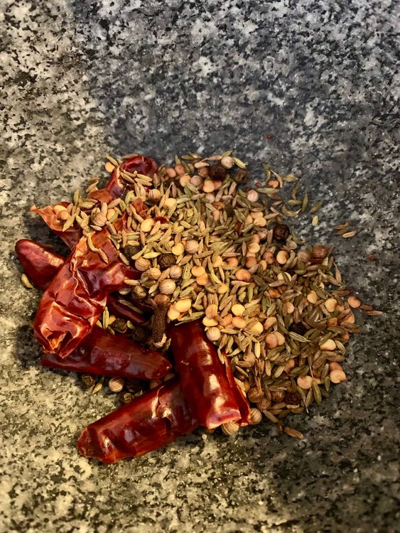 Step 1.2: Dry roast fennel seeds, black peppercorns, cloves, cumin seeds, coriander seeds, and dry red chillies in a small pan over low to medium heat until aromatic