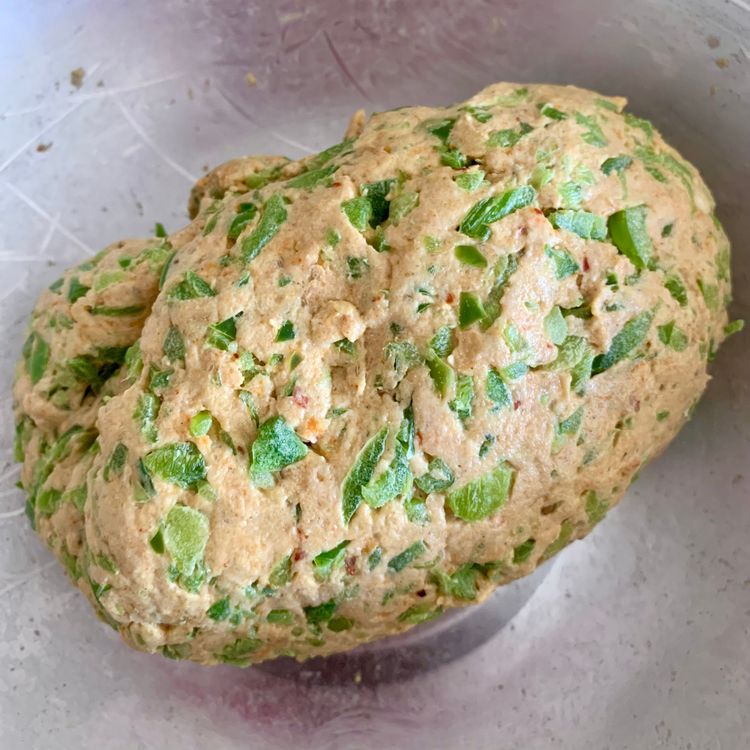 Step 1.1: Gradually add water and knead the mixture into a soft and pliable dough
