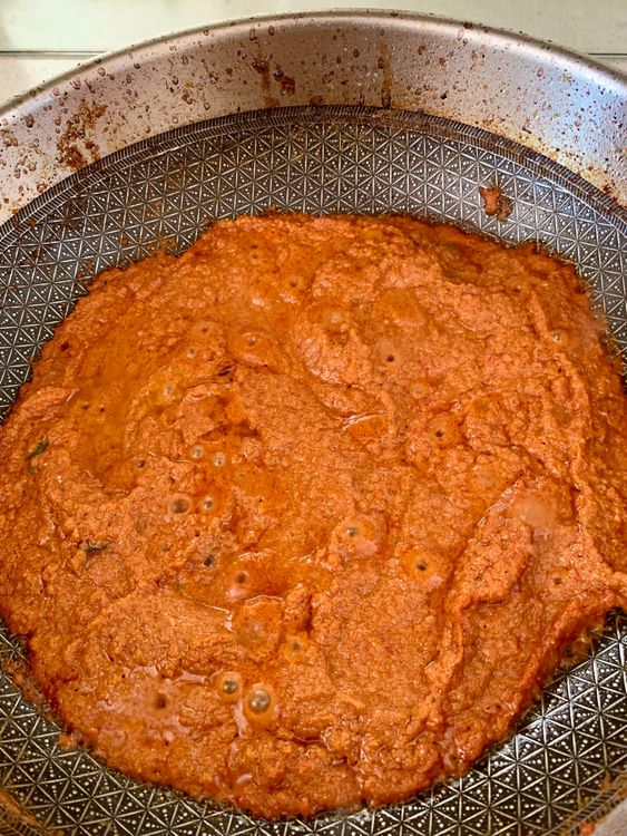Step 2.3: Lower the heat and add whisked curd and slit green chillies