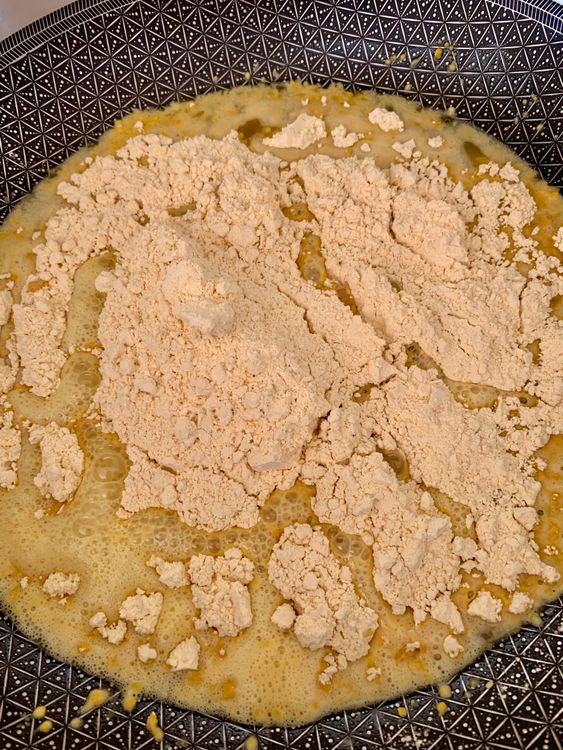 Step 3.1: Add the besan and roast it, stirring continuously, until it turns golden, aromatic, and the ghee begins to separate