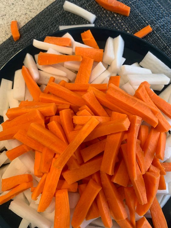 Step 1.1: Wash and pat dry the carrots and radishes, then finely slice them