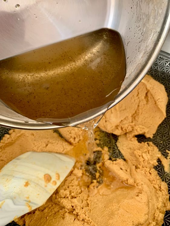 Step 3.1: Lower the heat and slowly pour in the prepared sugar syrup
