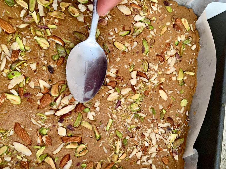 Step 4.1: Sprinkle the chopped nuts on top and gently press them in