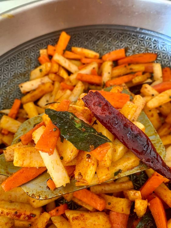 Step 1.1: Combine the sautéed radish and carrots in the pan, ensuring everything is well mixed