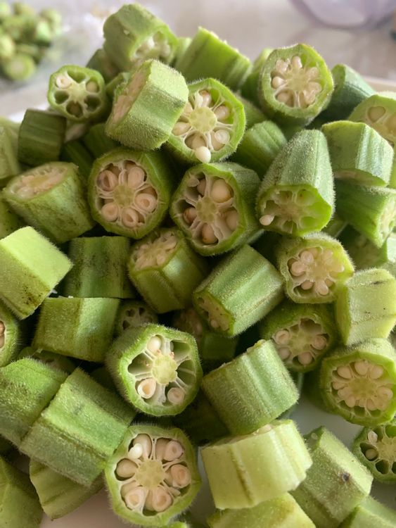 Step 1.1: Chop okra (bhindi) into small rounds, cube potatoes and onions