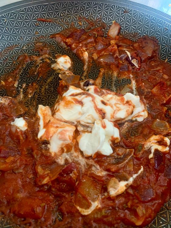 Step 1.1: Mix tomato puree and red chilli powder, then add yogurt