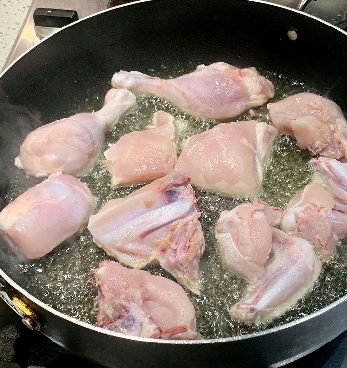 Step 1.1: Add ½ tsp salt in the hot oil and then add chicken pieces