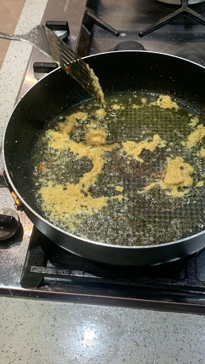 Step 1.1: Add the ginger and garlic paste and 7-8 black peppercorns and stir-fry in the same wok for 2-3 minutes until fragrant