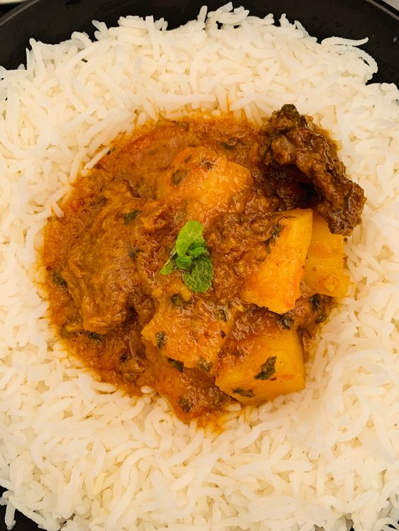 Step 5.1: Serve hot with roti, paratha, or steamed rice, along with a side of cooling raita