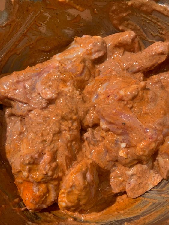 Step 1.1: Add the chicken wings and mix well to coat them evenly