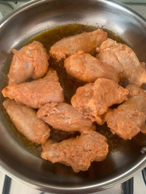 Step 2.1: Heat mustard oil in a wide pan over medium-high heat
