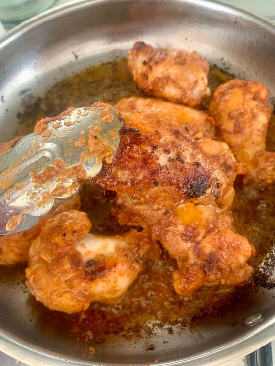 Step 2.2: Heat mustard oil in a wide pan over medium-high heat