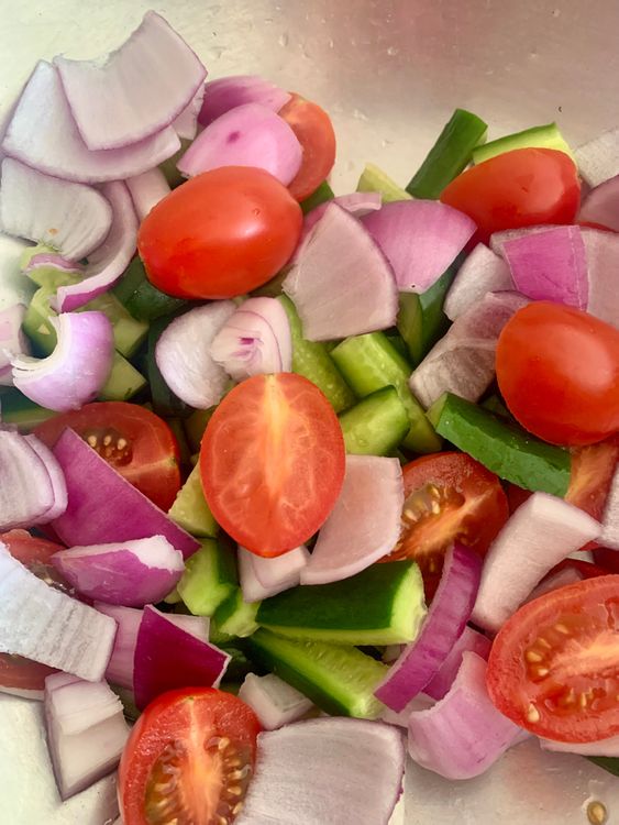 Step 1.1: Combine the cherry tomatoes, cucumber, onion and salad leaves in a large mixing bowl