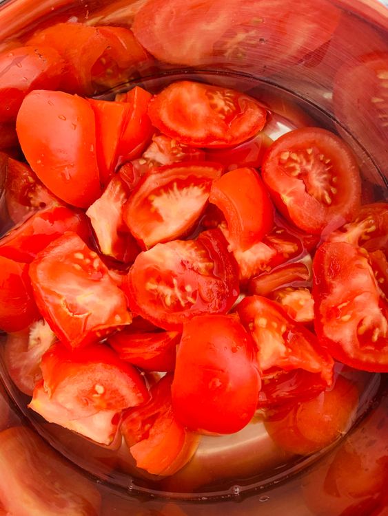 Step 2.1: In a pressure cooker, add the tomatoes with 1 cup of water