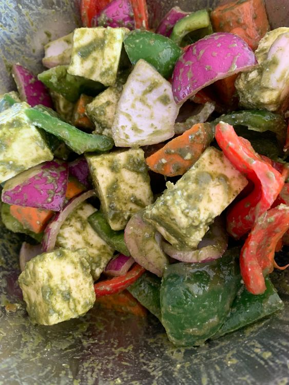 Step 1.1: In a bowl, combine the cubed paneer with 1 tablespoon of olive oil, salt, black pepper powder, red chilli flakes, and 4 tablespoons of the prepared green chutney