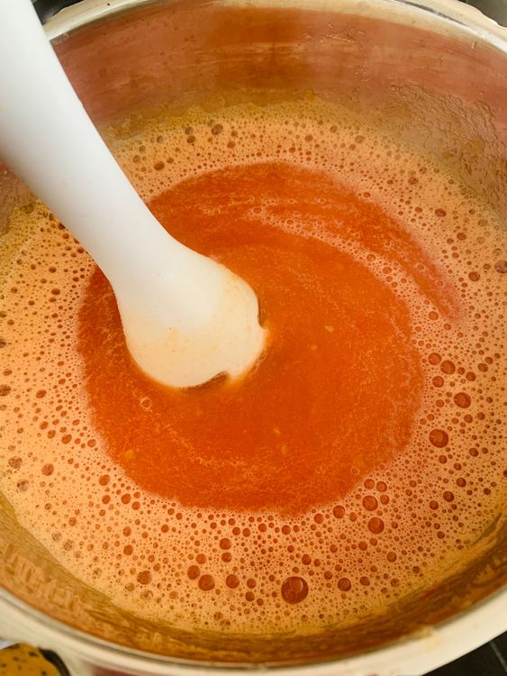 Step 2.1: Once cooled slightly, blend the tomatoes into a smooth puree