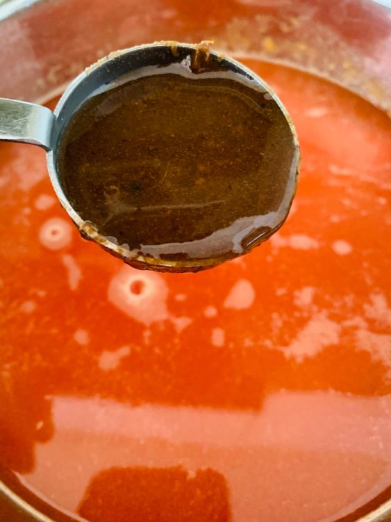 Step 3.1: Pour the strained tomato puree back into the pot