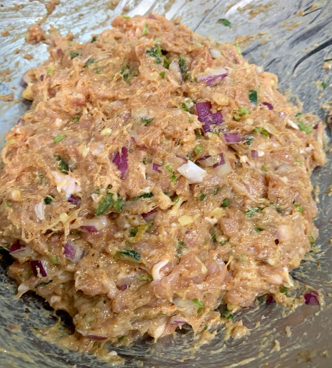 Step 1.1: Combine the chicken mince, onion, green chillies, garlic ginger paste, oil, seekh kebab masala, salt, egg (if adding), and green coriander in a large mixing bowl