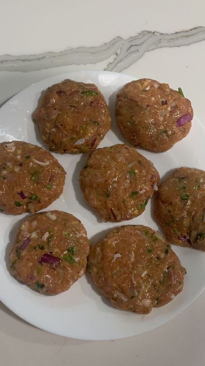Step 1.1: After mixing the chicken mince, wet your hands with water and shape the mixture into small, flat patties