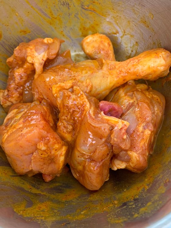 Step 1.1: In a bowl, mix the chicken with curd, salt, turmeric, Kashmiri chilli powder, and mustard oil