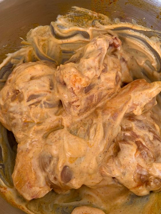 Step 1.2: In a bowl, mix the chicken with curd, salt, turmeric, Kashmiri chilli powder, and mustard oil