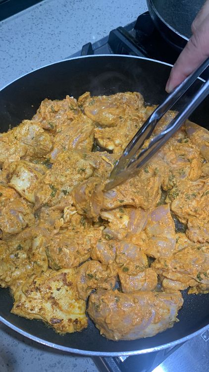 Step 1.1: Add the marinated chicken pieces to the pan and cook them for 5-6 minutes, stirring occasionally