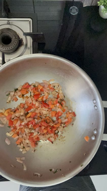 Step 1.1: Now add onion and tomato along with salt

