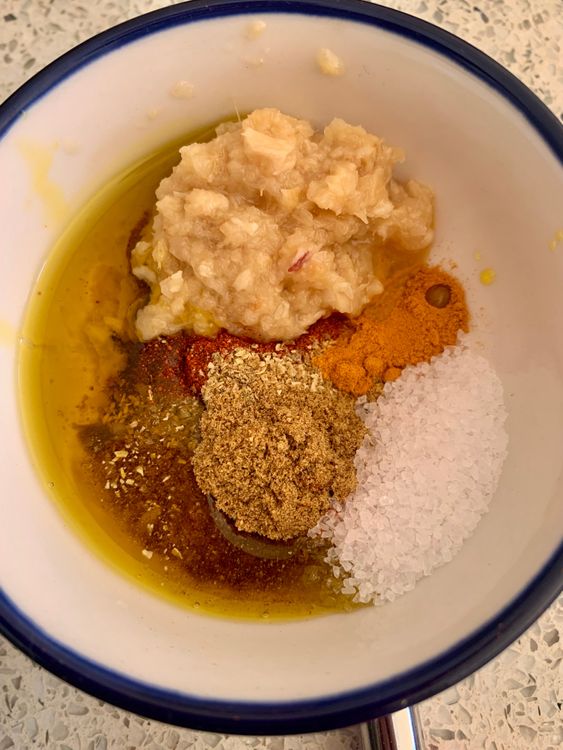Step 2.1: In a small bowl, combine the ginger-garlic paste, Kashmiri chilli powder, coriander, cumin, turmeric, salt, and mustard oil