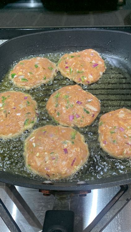 Step 2.1: Once the oil is hot, add the patties to the pan, making sure not to overcrowd the pan