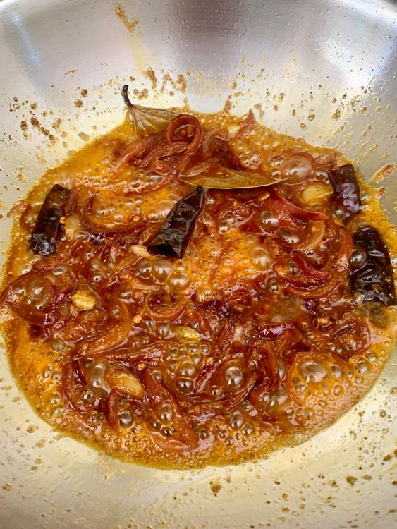 Step 4.2: Stir in the prepared masala paste with a splash of water