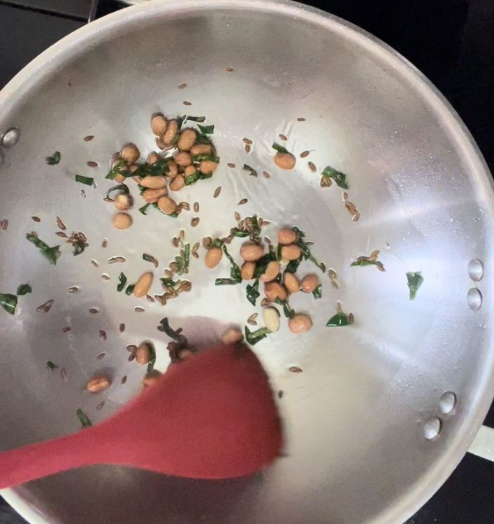 Step 1.1: In a pan put oil followed by cumin seeds,curry leaves and peanuts
