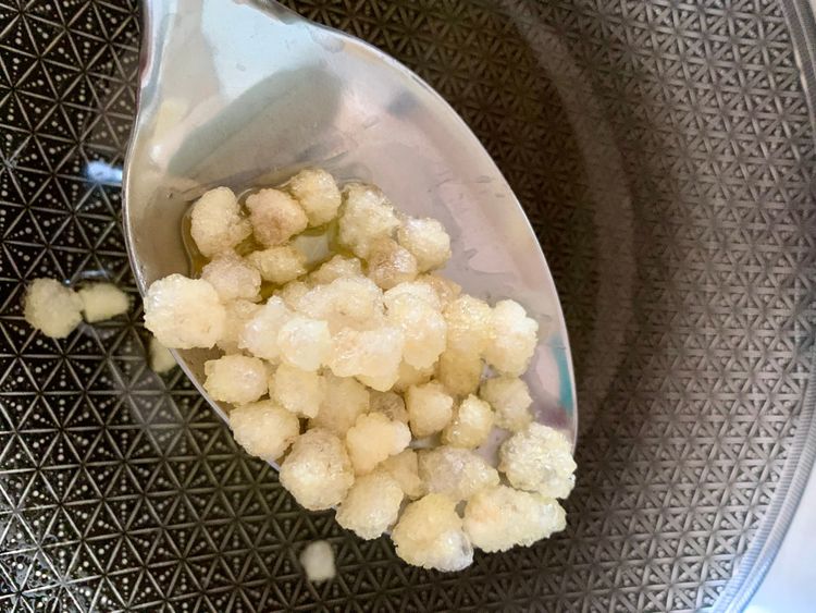 Step 1.2: Add the gond and fry while stirring until it puffs up and turns crunchy