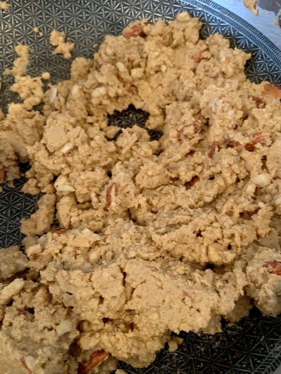 Step 5.2: Add the ground nut-gond-makhana mix into the roasted flour and mix well for 3–4 minutes