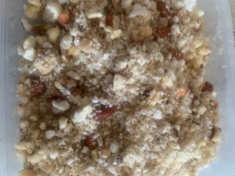 Step 3.2: Once cooled, coarsely grind the gond, nuts, and makhana together