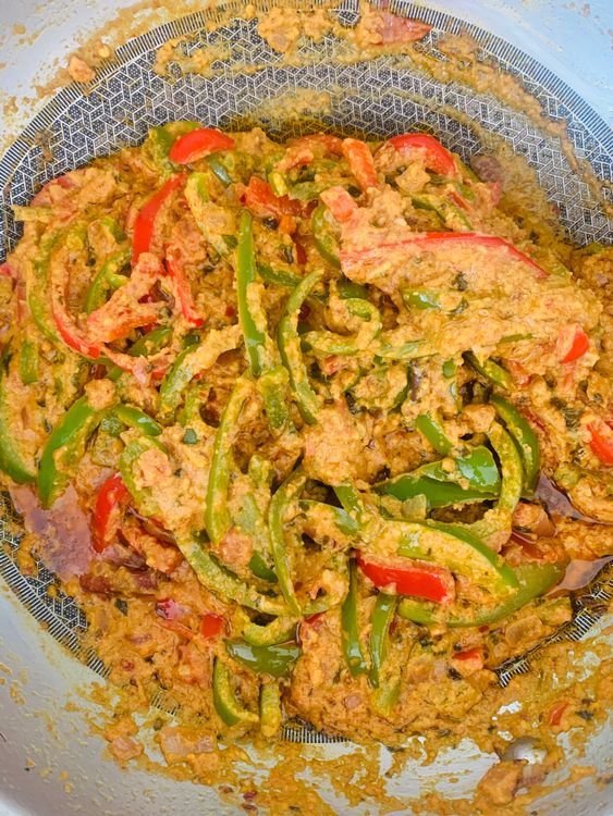 Step 5.2: Add the sliced capsicum and toss well to coat with the masala