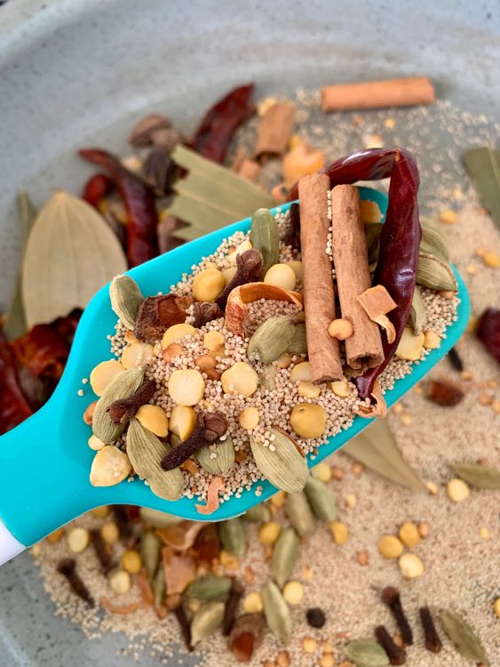 Step 1.2: In the same pan, roast the remaining whole spices (cloves, cardamoms, cinnamon, poppy seeds, chana dal, star anise, mace, nutmeg, bay leaves, and red chilies) until aromatic