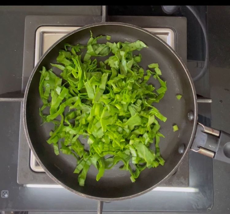 Step 1.1: Take a non stick pan and add chopped spinach in it
