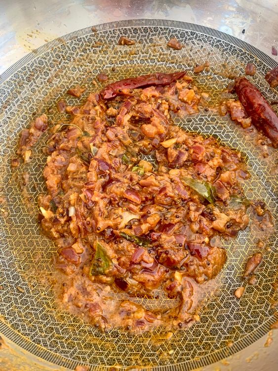 Step 1.1: Stir in the tomato purée, then add coriander powder, cumin powder, and turmeric