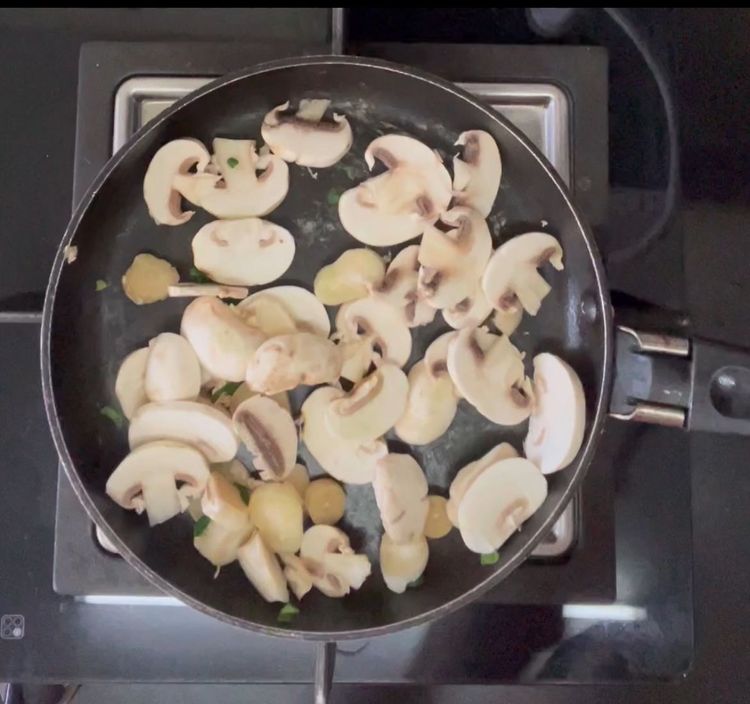 Step 1.1: In the same pan add mushroom along with a pinch of salt

