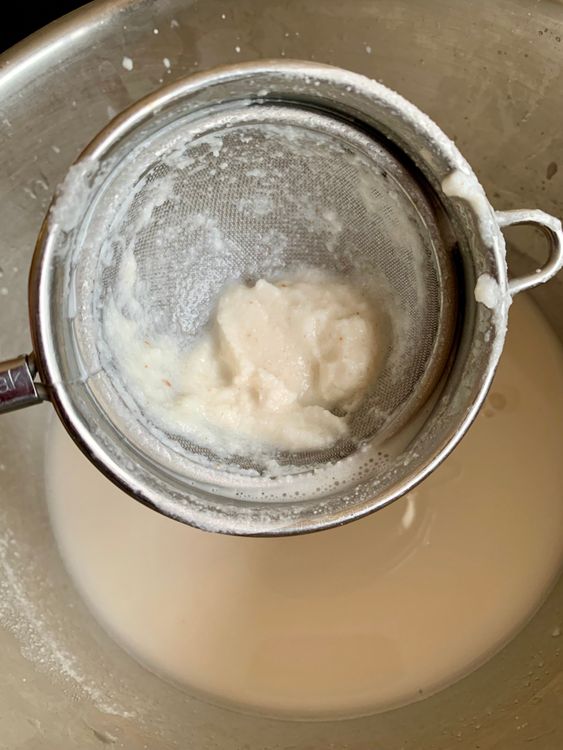Step 2.1: Strain the mixture through a fine-mesh sieve or cheesecloth into a large bowl or pitcher, pressing or squeezing well to extract all the liquid